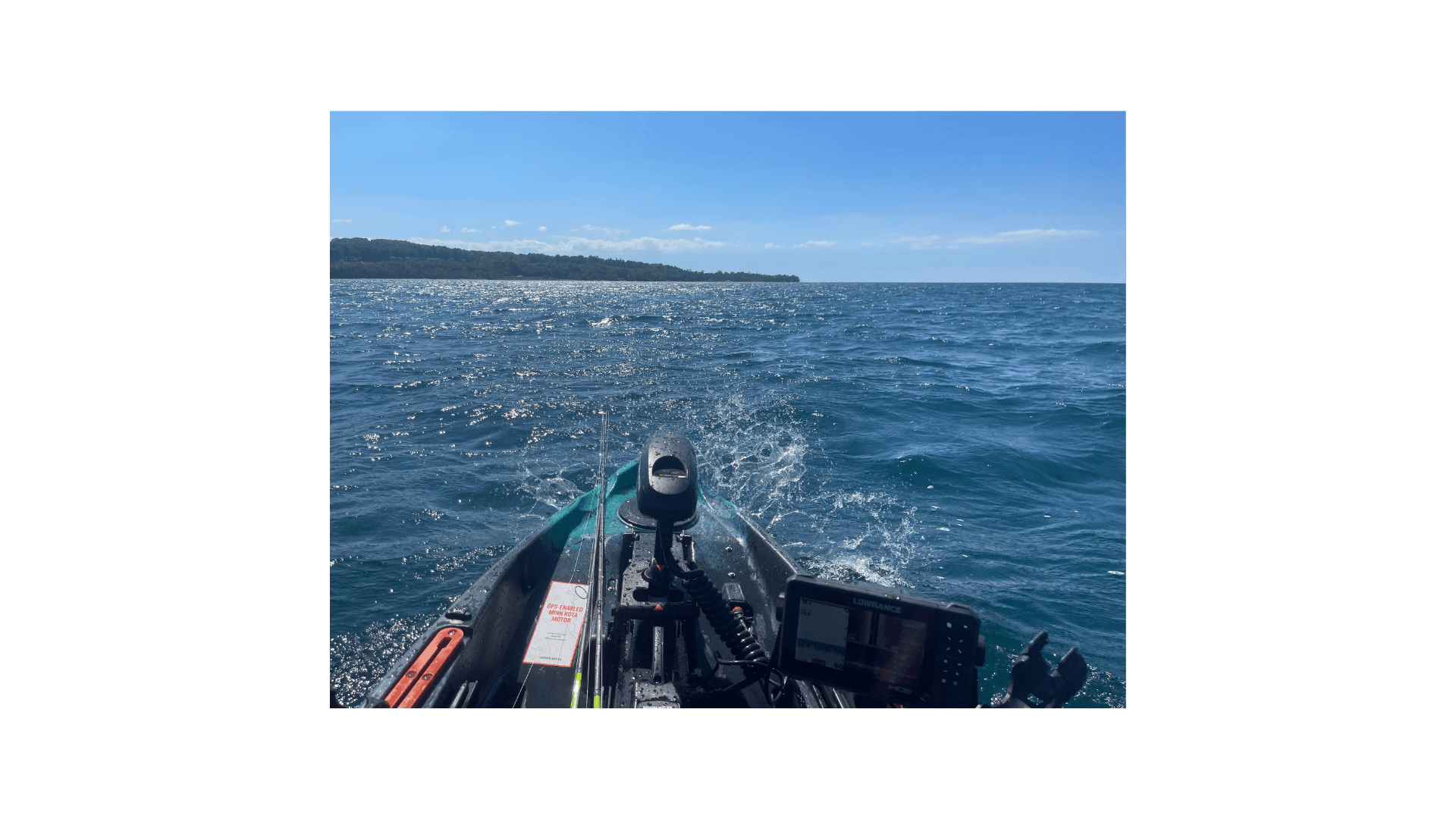 Old Town Autopilot kayak underway on Lake Michigan with fish finder visible